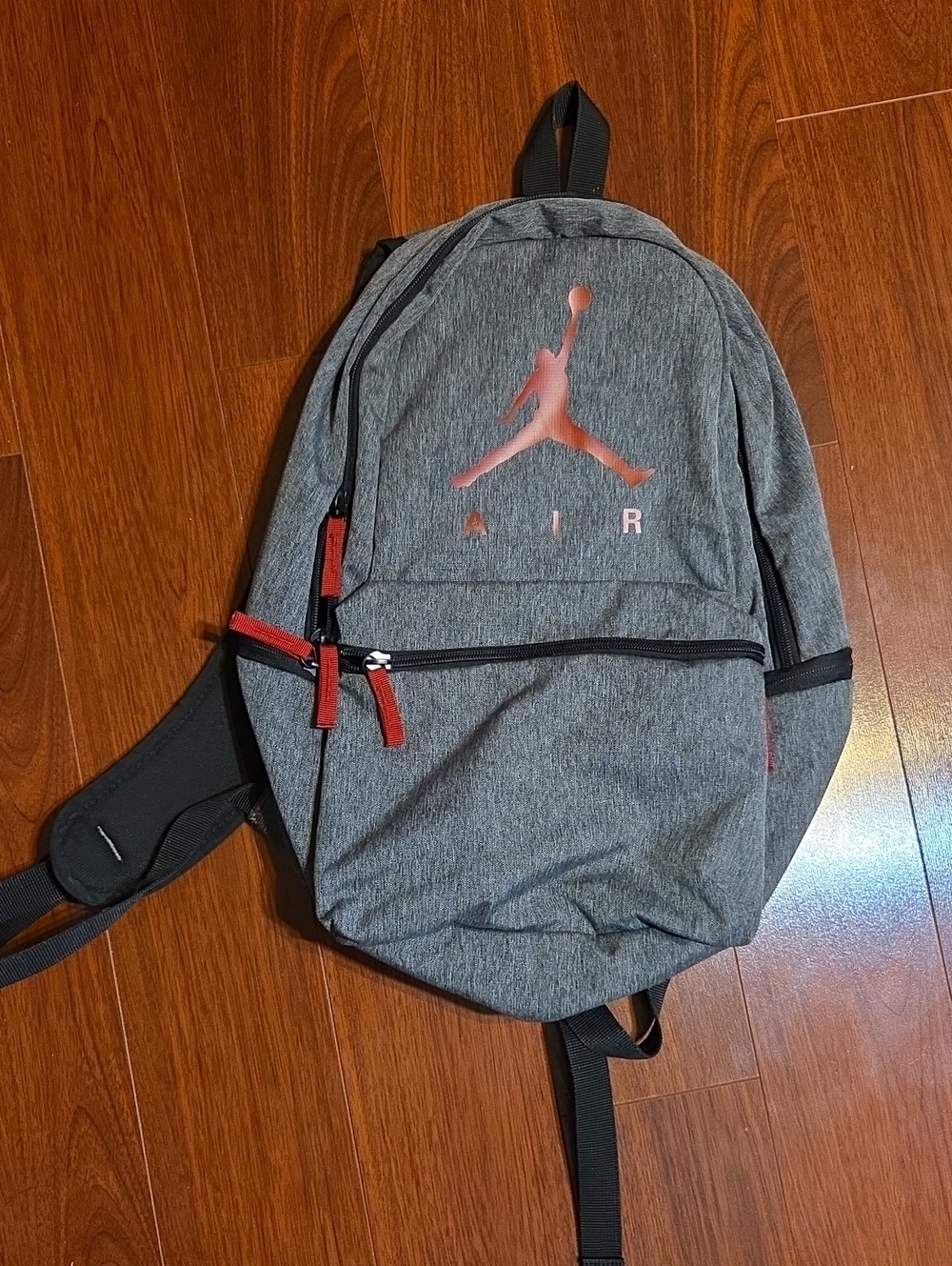 Jordan Kids Grey Backpack with Red Jumpman Accents